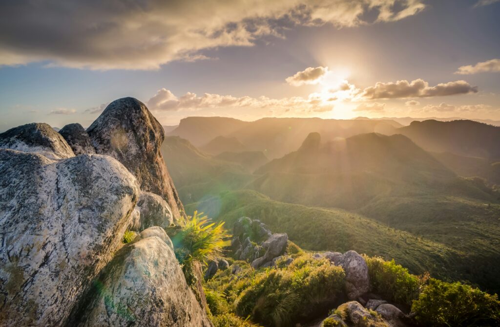 Sunrise over serene mountain landscape.