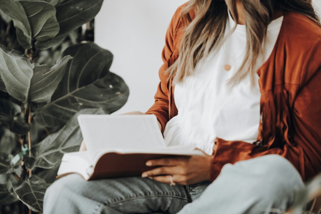 A woman reading peacefully, symbolizing calmness and empowerment when setting boundaries with a narcissistic mother.